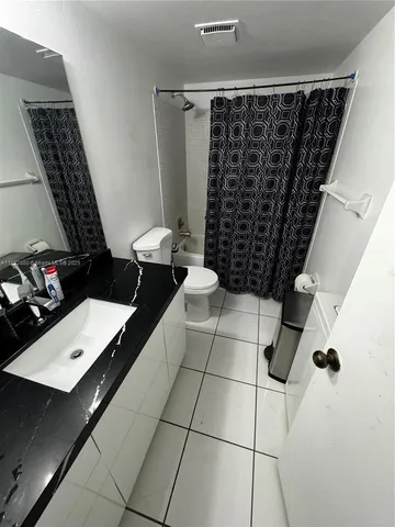 a view of house with yard