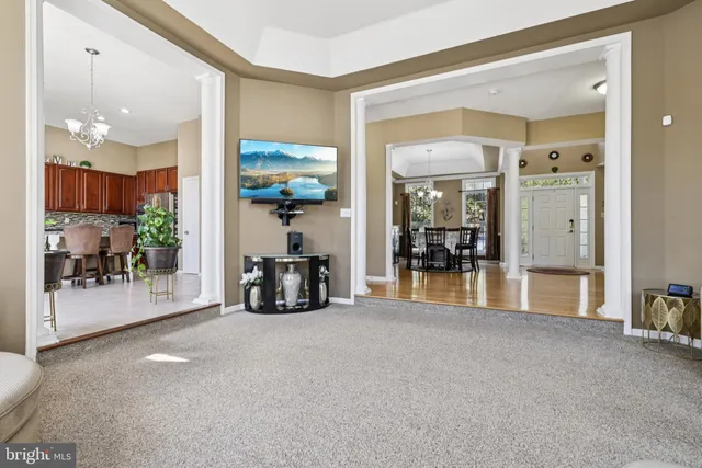 a view of a living room and dining room
