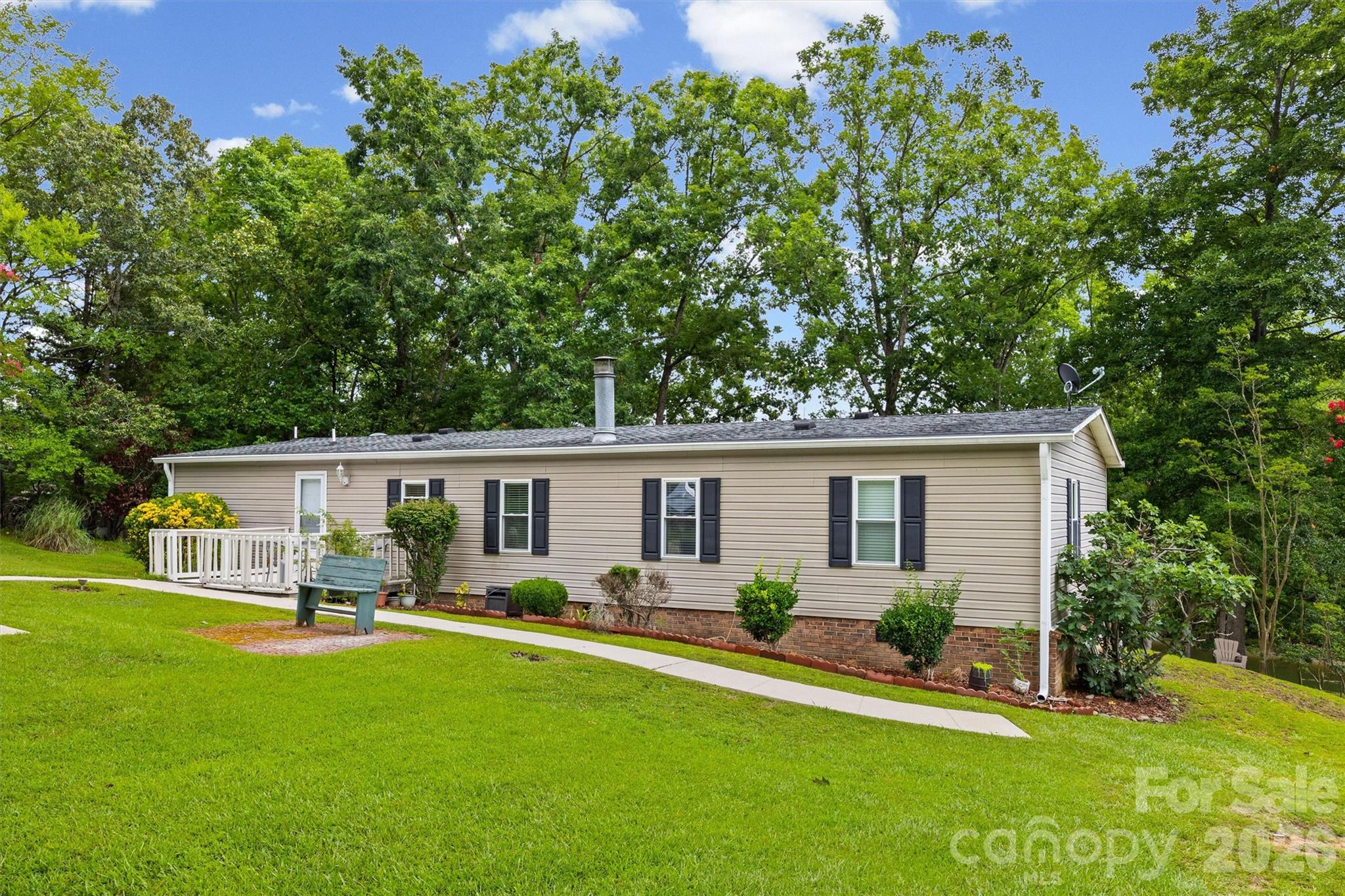 2071 Chameleon Road, Unit 156 York, SC 29745 - Photo 3 of 46 a front view of house with yard and outdoor seating