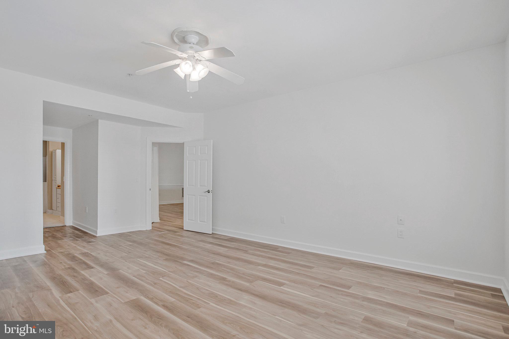 322 Hamlet Circle Edgewater, MD 21037 - Photo 13 of 21 a view of an empty room with wooden floor