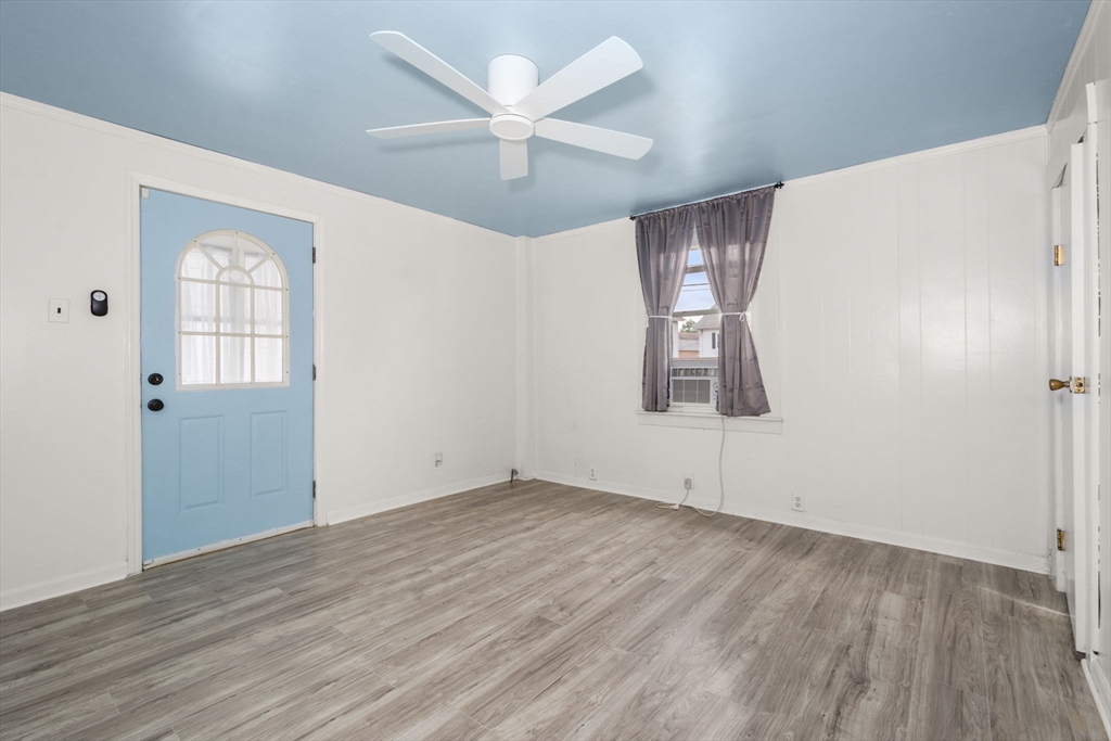 97 Mechanic Street Westfield, MA 01085 - Photo 15 of 40 a view of empty room with wooden floor and ceiling fan