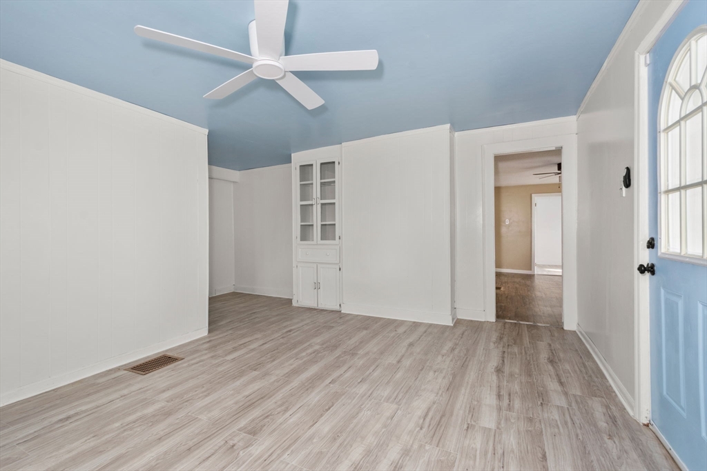 97 Mechanic Street Westfield, MA 01085 - Photo 16 of 40 wooden floor in an empty room with a window