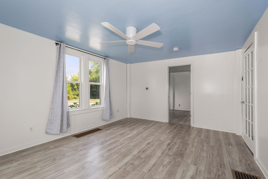 97 Mechanic Street Westfield, MA 01085 - Photo 21 of 40 wooden floor in an empty room with a window