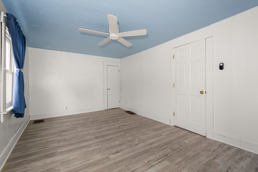 97 Mechanic Street Westfield, MA 01085 - Photo 24 of 40 a view of an empty room with wooden floor