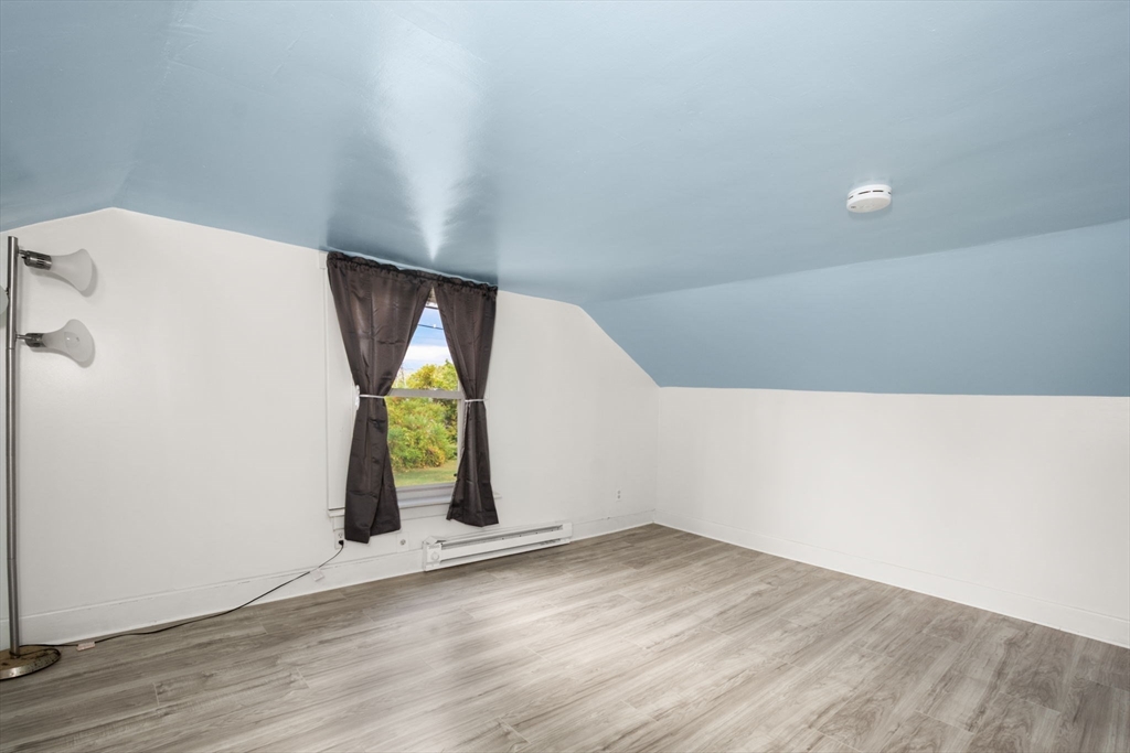 97 Mechanic Street Westfield, MA 01085 - Photo 33 of 40 a view of empty room with wooden floor