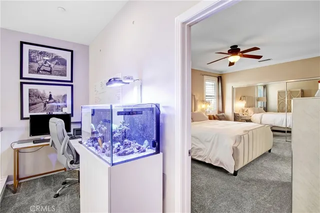 a bedroom with bed and a chandelier