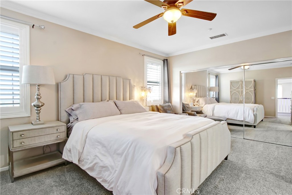 12422 Benton Drive, Unit 1 Rancho Cucamonga, CA 91739 - Photo 12 of 20 a bedroom with bed and a chandelier