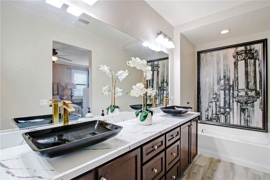 12422 Benton Drive, Unit 1 Rancho Cucamonga, CA 91739 - Photo 14 of 20 a bathroom with a sink and a mirror