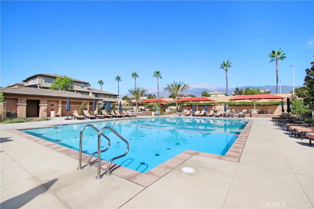 12422 Benton Drive, Unit 1 Rancho Cucamonga, CA 91739 - Photo 17 of 20 a view of a swimming pool with a lounge chairs
