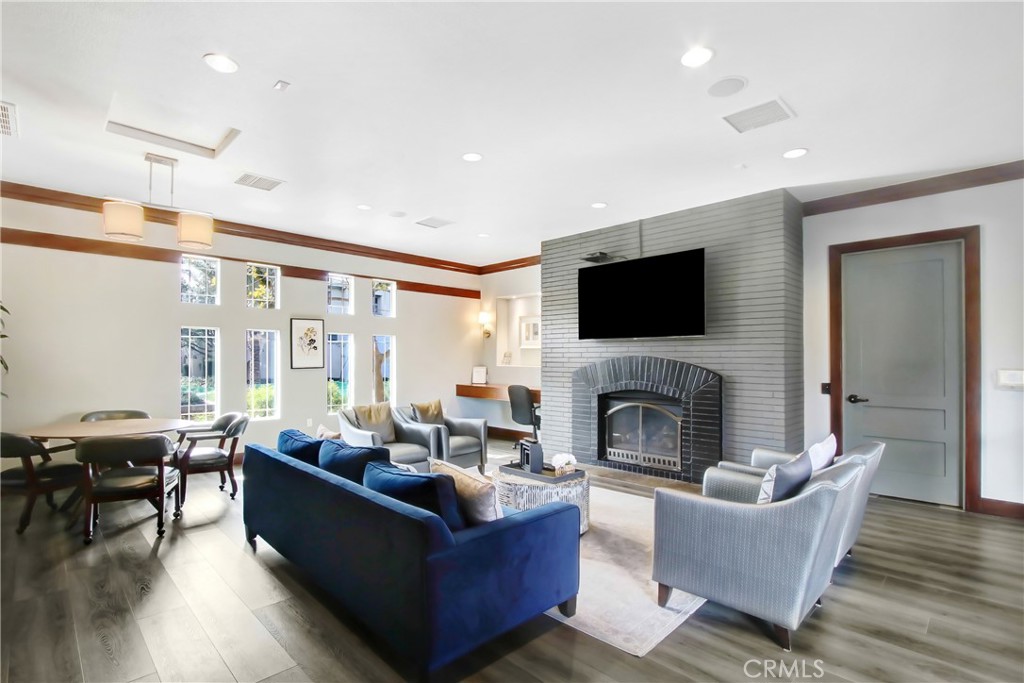 12422 Benton Drive, Unit 1 Rancho Cucamonga, CA 91739 - Photo 18 of 20 a living room with furniture flat screen tv and a fireplace