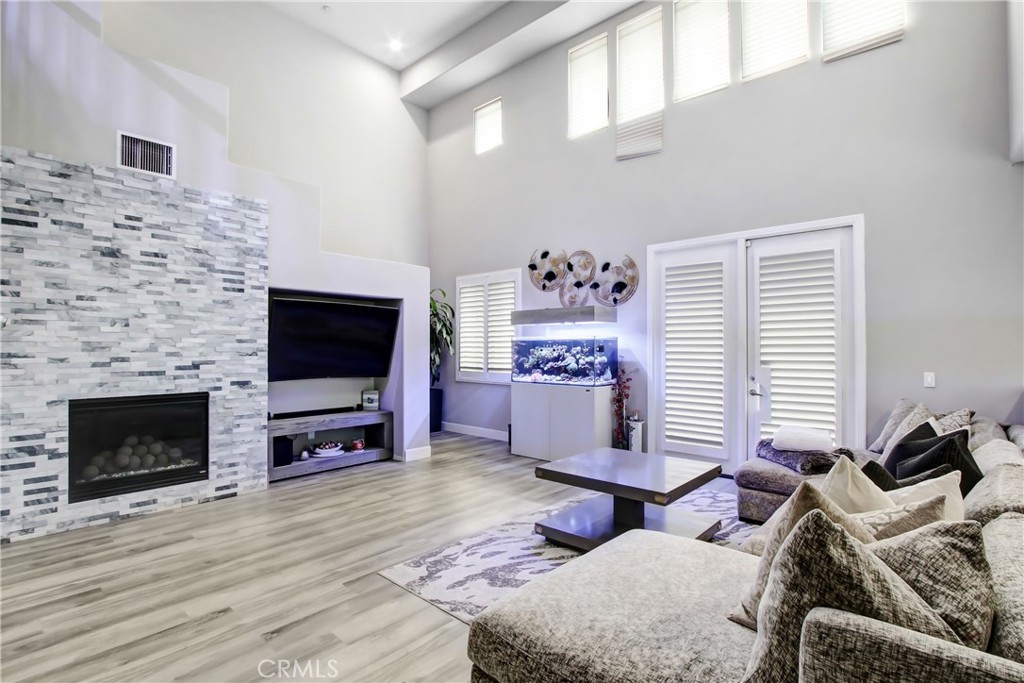 12422 Benton Drive, Unit 1 Rancho Cucamonga, CA 91739 - Photo 2 of 20 a bedroom with furniture and a flat screen tv