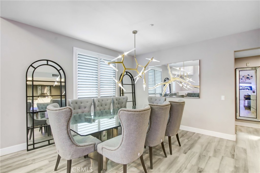 12422 Benton Drive, Unit 1 Rancho Cucamonga, CA 91739 - Photo 6 of 20 a dining room with furniture a window and wooden floor