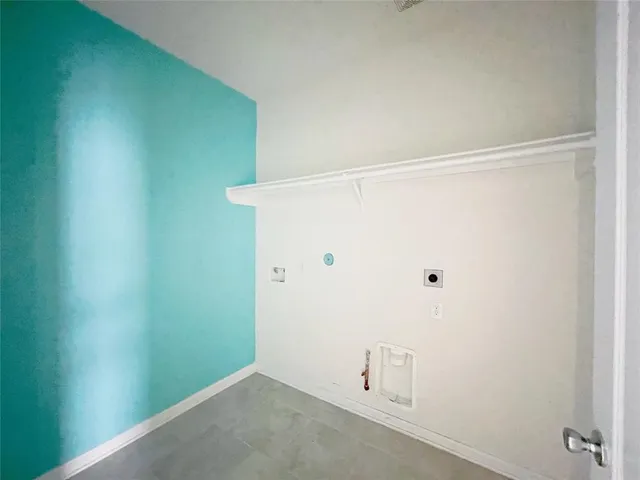 a view of a backyard with wooden floor and floor to ceiling window