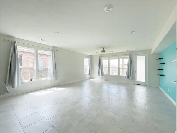 a view of an empty room with a window