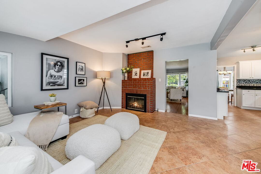 4539 Atoll Avenue Sherman Oaks, CA 91423 - Photo 13 of 28 a living room with furniture and a fireplace