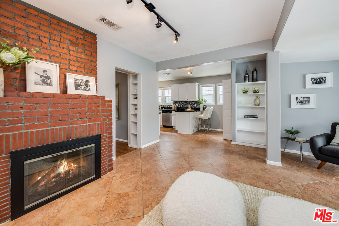 4539 Atoll Avenue Sherman Oaks, CA 91423 - Photo 14 of 28 a view of a livingroom with furniture and a fireplace