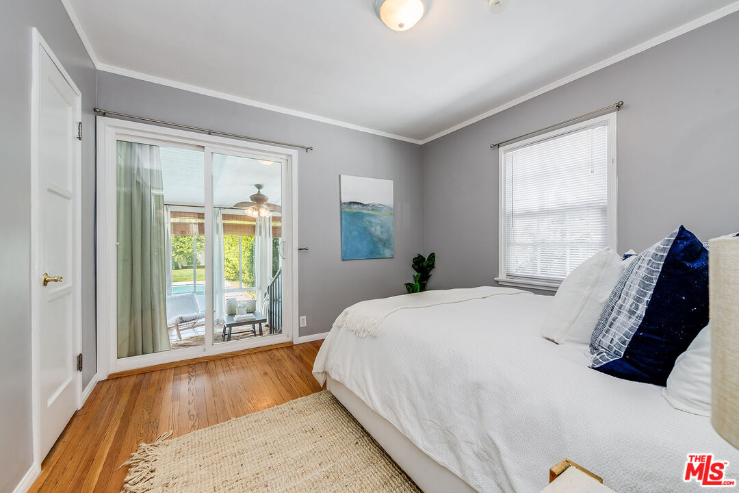 4539 Atoll Avenue Sherman Oaks, CA 91423 - Photo 18 of 28 a bedroom with a bed and a large window