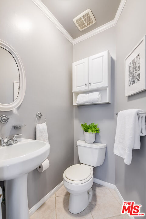 4539 Atoll Avenue Sherman Oaks, CA 91423 - Photo 20 of 28 a bathroom with a sink mirror vanity and toilet