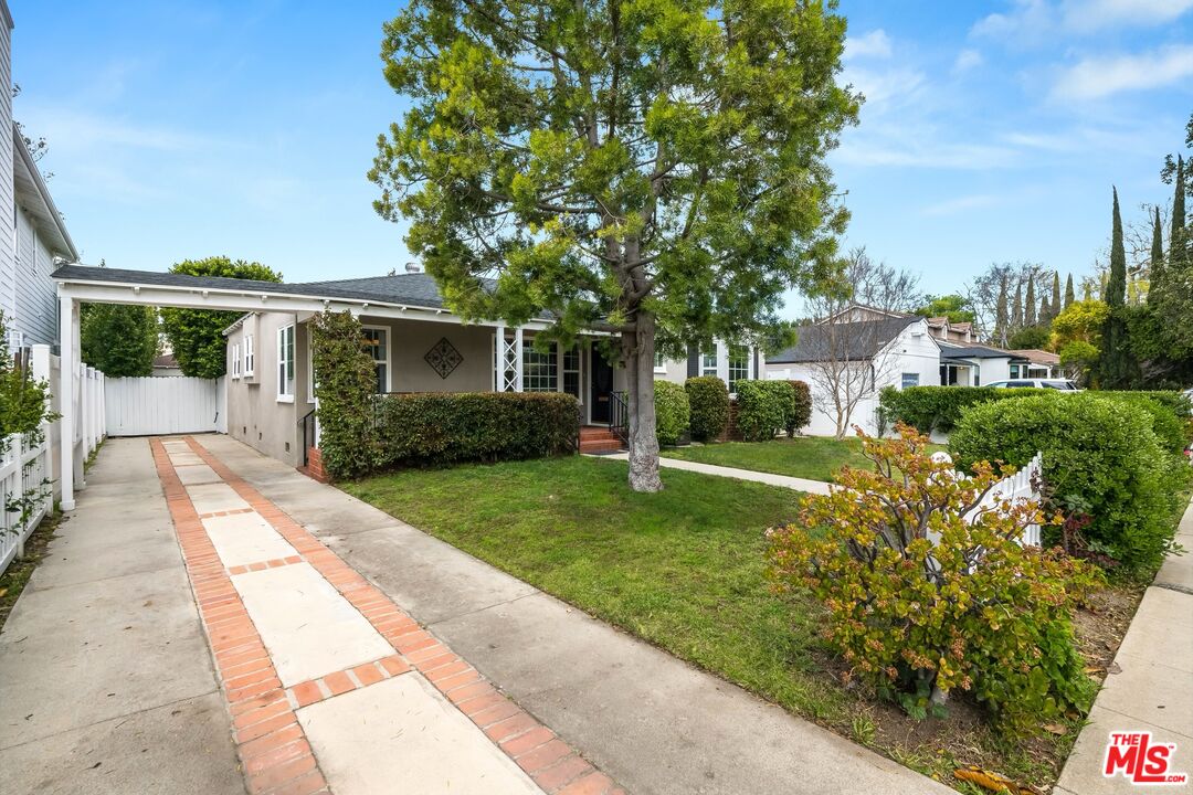 4539 Atoll Avenue Sherman Oaks, CA 91423 - Photo 3 of 28 a front view of a house with garden