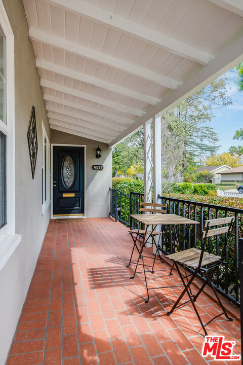 4539 Atoll Avenue Sherman Oaks, CA 91423 - Photo 4 of 28 a view of a chairs and table in the patio