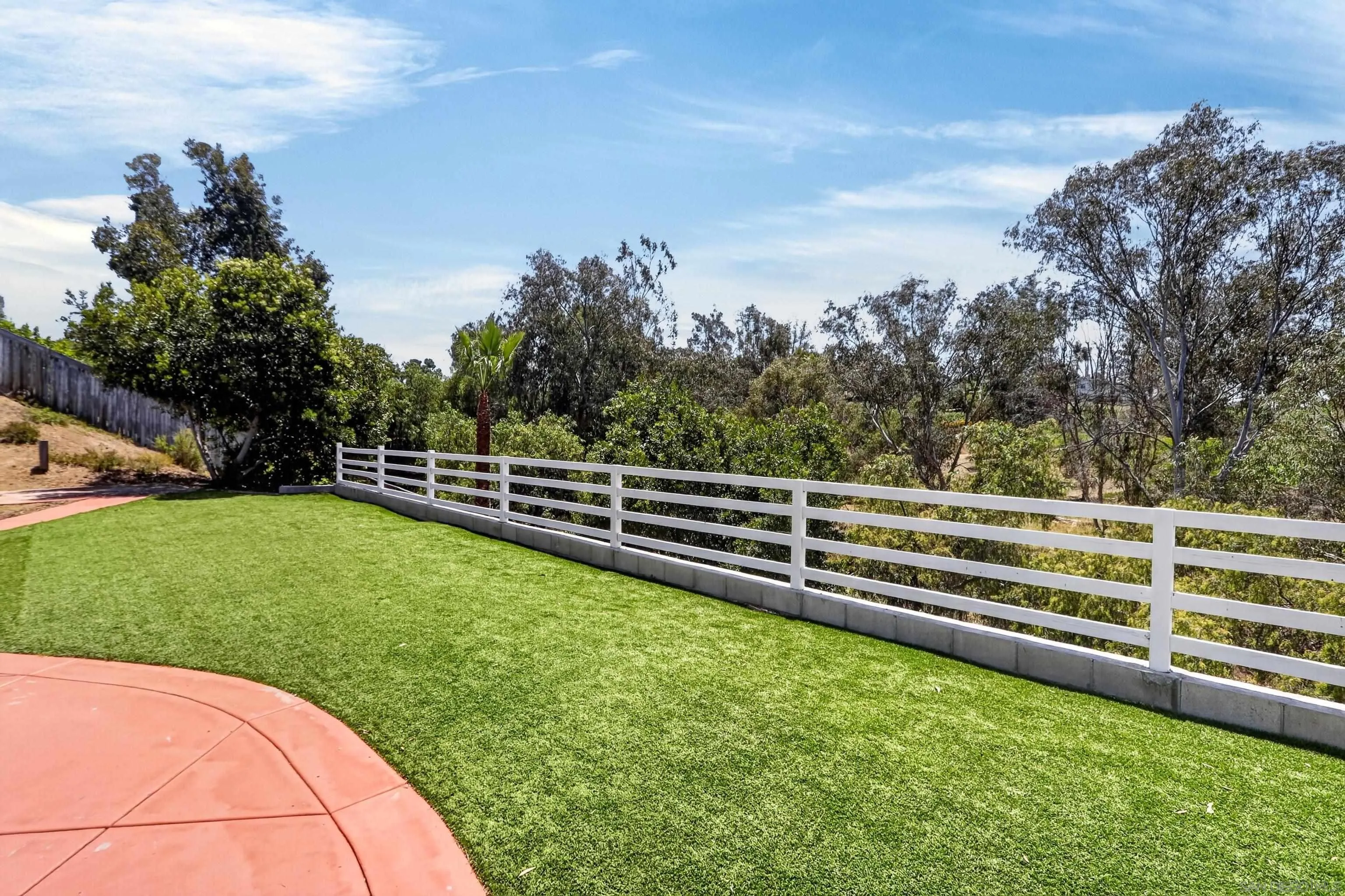 1432 Belmont Park Road Oceanside, CA 92057 - Photo 13 of 54 a view of a yard with wooden fence
