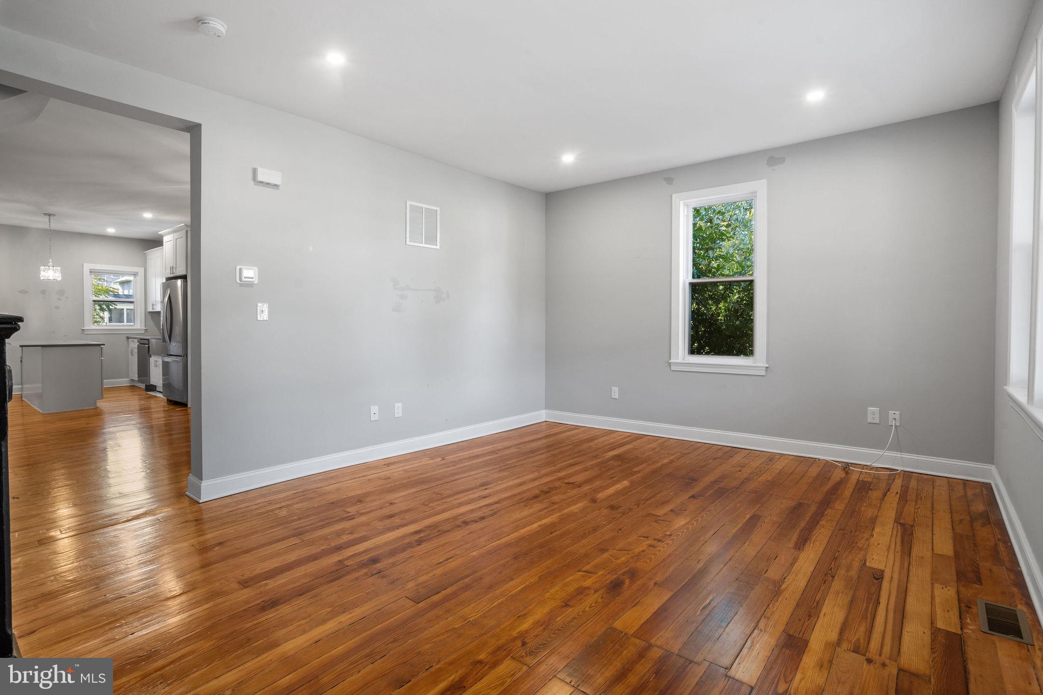144 Snyder Place Moorestown, NJ 08057 - Photo 12 of 36 a view of an empty room with wooden floor and a window