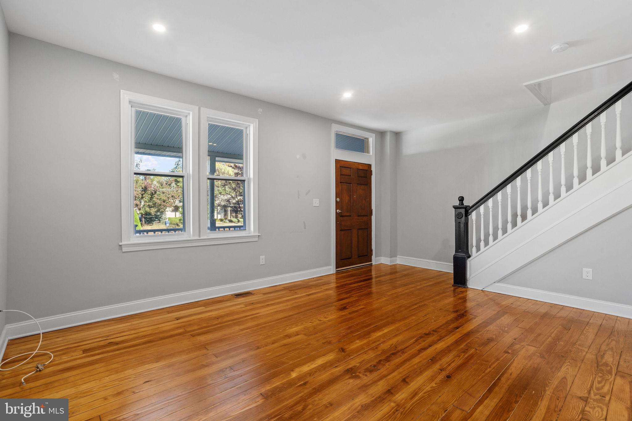 144 Snyder Place Moorestown, NJ 08057 - Photo 21 of 36 a view of an empty room with wooden floor and a window