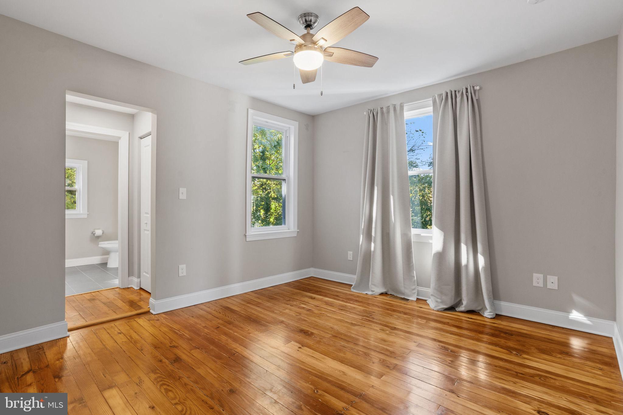 144 Snyder Place Moorestown, NJ 08057 - Photo 22 of 36 a bedroom with a bed and a chandelier fan