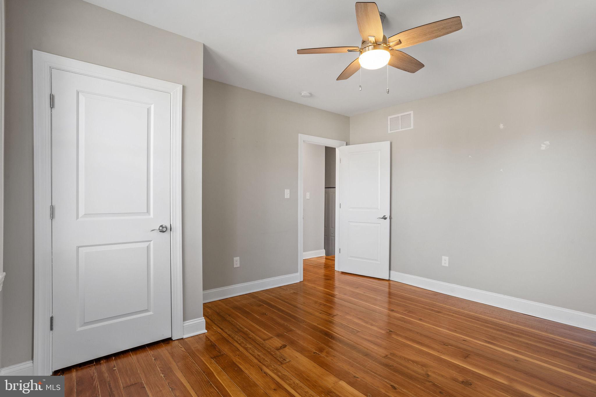 144 Snyder Place Moorestown, NJ 08057 - Photo 23 of 36 a view of empty room with wooden floor and fan