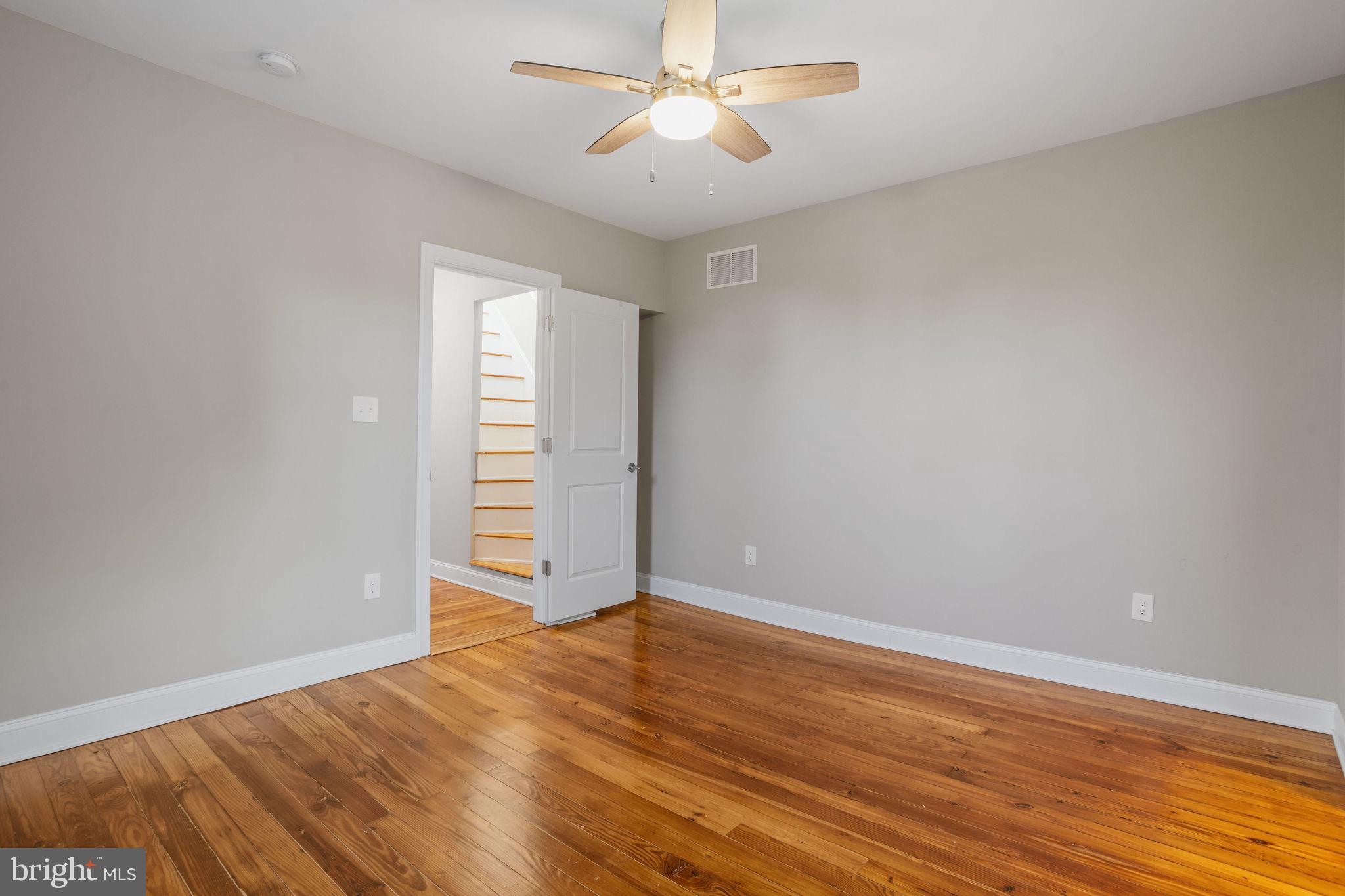 144 Snyder Place Moorestown, NJ 08057 - Photo 24 of 36 a view of empty room with wooden floor and fan