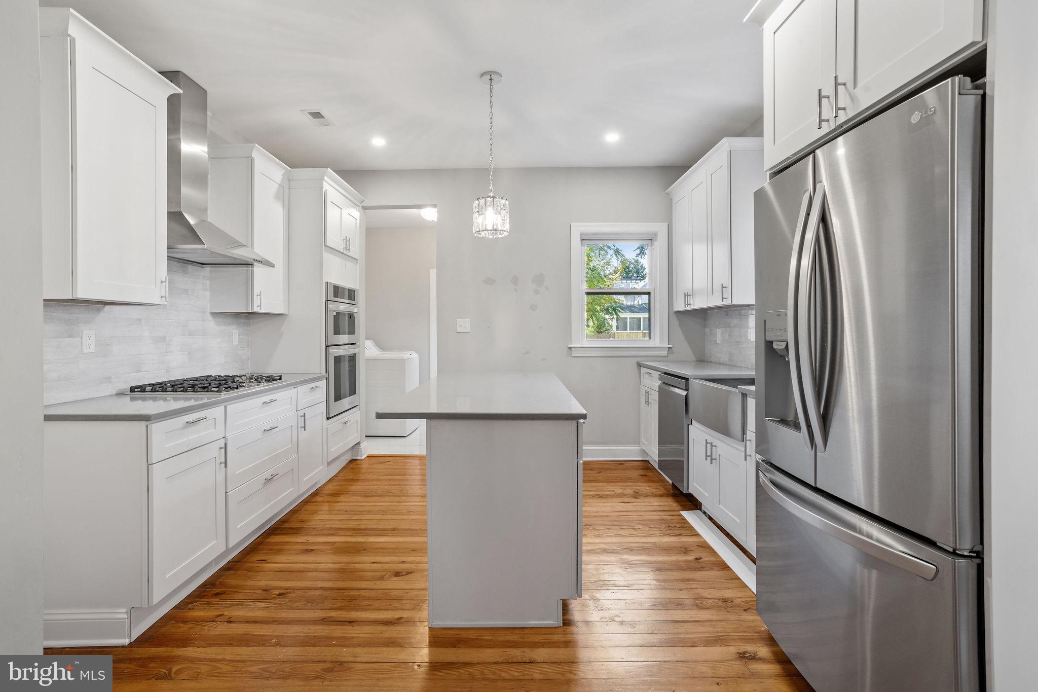 144 Snyder Place Moorestown, NJ 08057 - Photo 25 of 36 a kitchen with stainless steel appliances a refrigerator sink and white cabinets