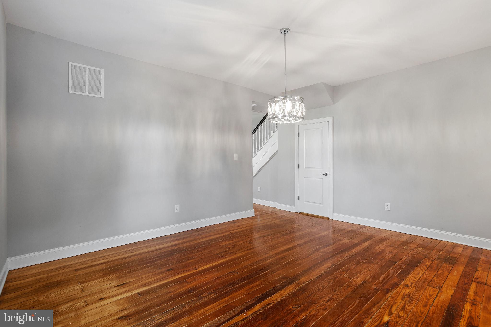 144 Snyder Place Moorestown, NJ 08057 - Photo 29 of 36 a view of an empty room with wooden floor and chandelier