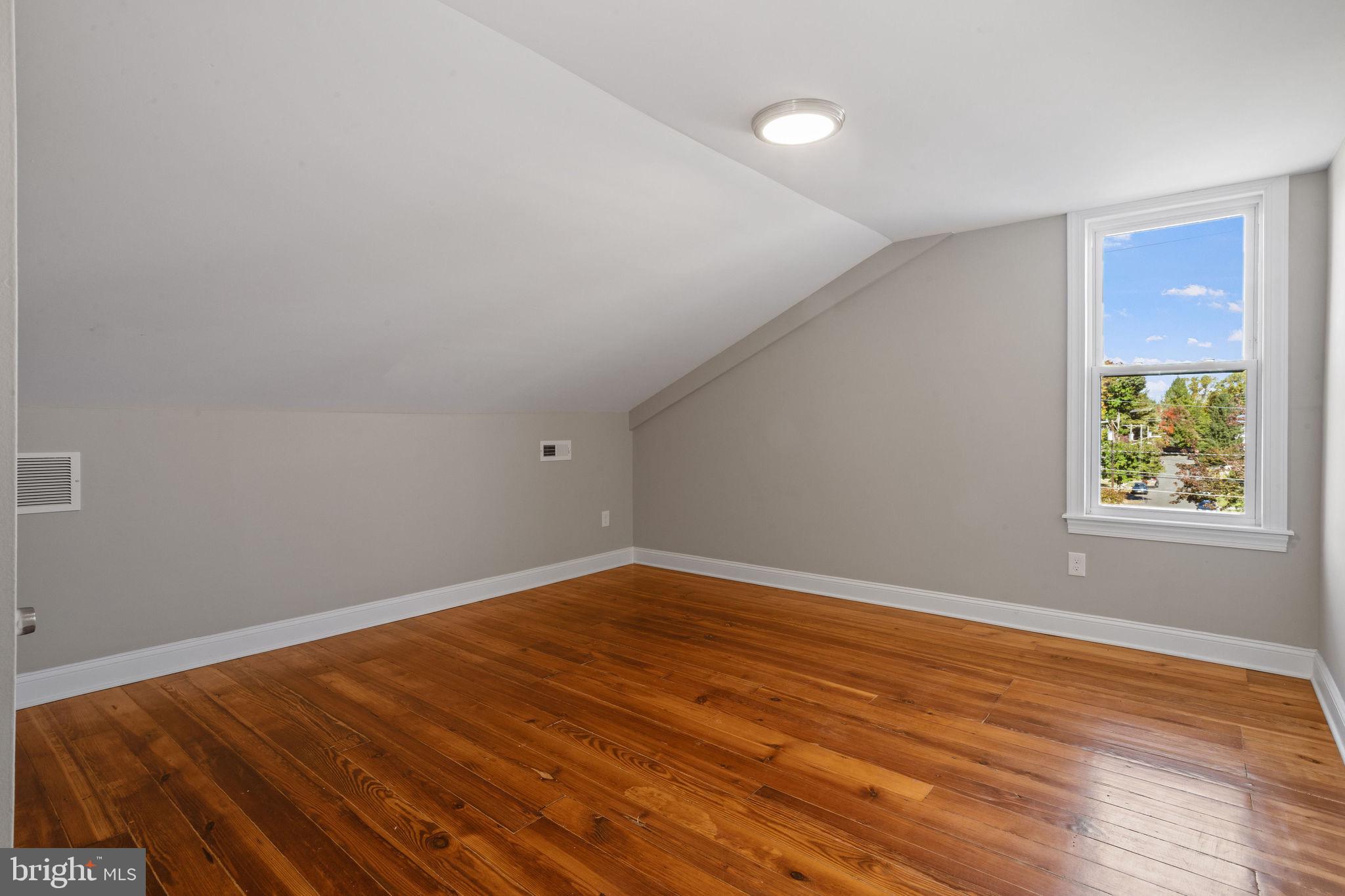 144 Snyder Place Moorestown, NJ 08057 - Photo 32 of 36 an empty room with wooden floor and windows