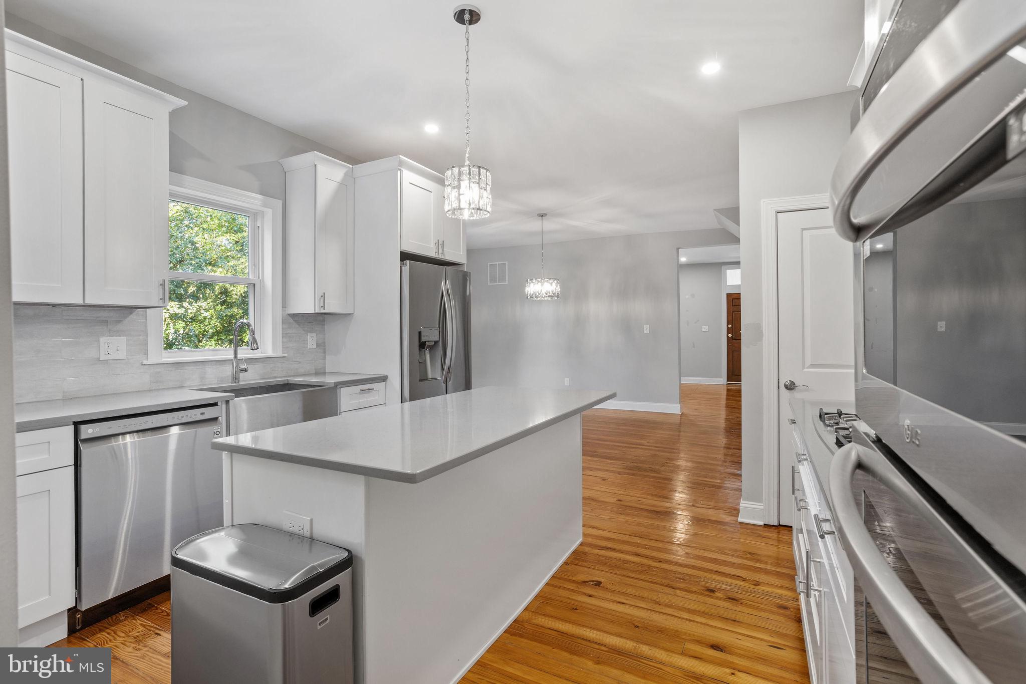 144 Snyder Place Moorestown, NJ 08057 - Photo 33 of 36 a kitchen with stainless steel appliances kitchen island a refrigerator and a sink