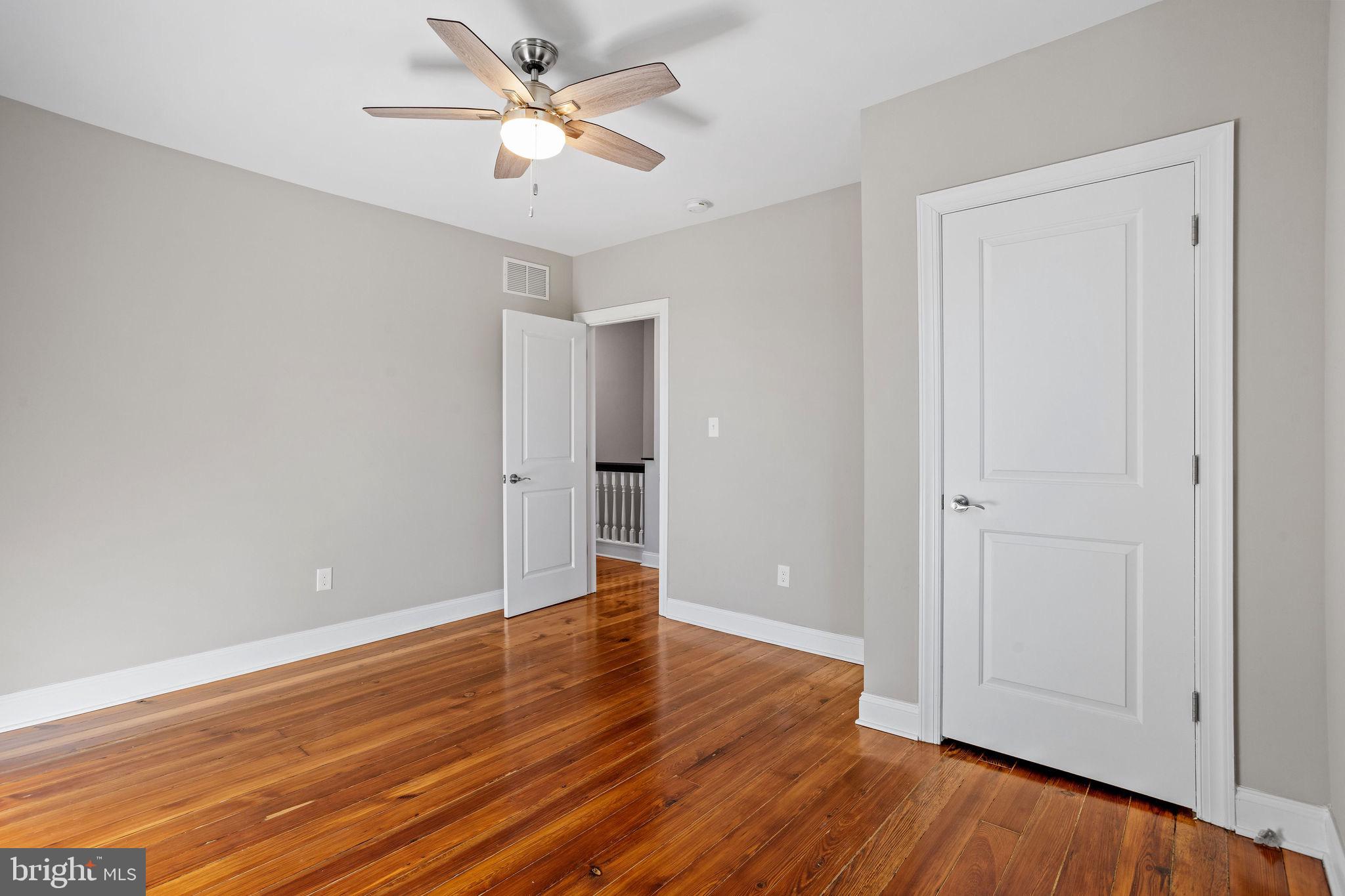 144 Snyder Place Moorestown, NJ 08057 - Photo 9 of 36 a view of an empty room with wooden floor