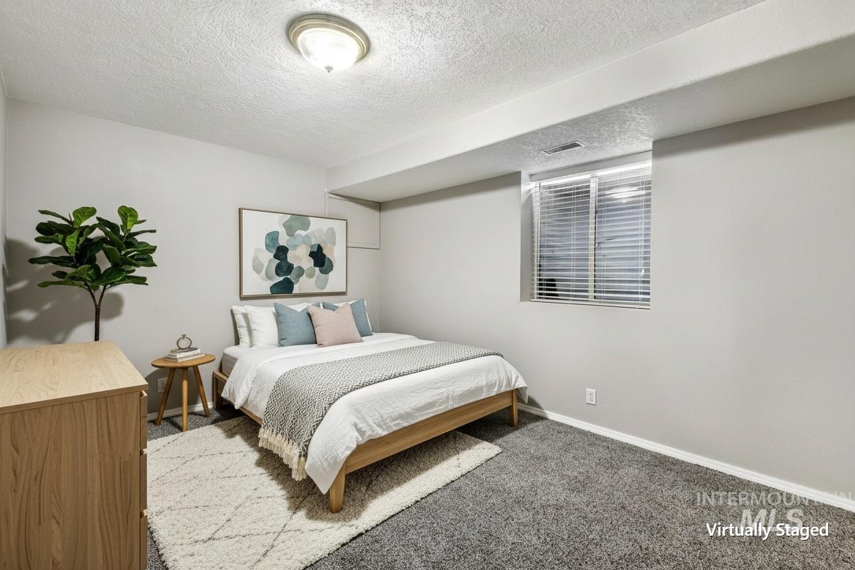 445 South College Street Oakley, ID 83346 - Photo 12 of 24 Carpeted room with a recessed window featuring blinds, light gray wall paint, and a semi-flush ceiling light fixture