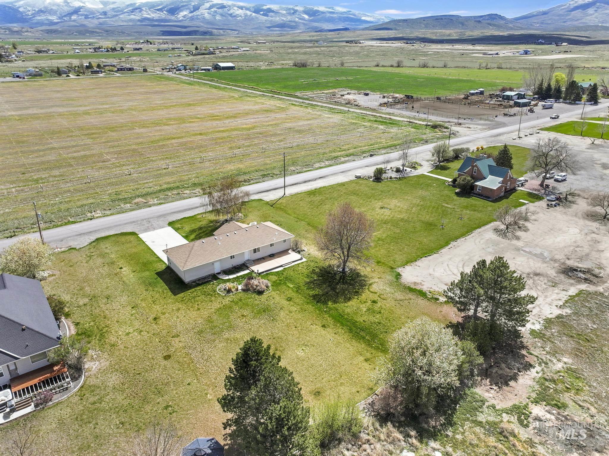 445 South College Street Oakley, ID 83346 - Photo 21 of 24 Aerial view of sparsely populated area featuring a mountainous background