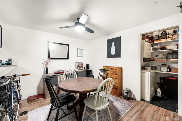 a view of a dining room with furniture and wooden floor