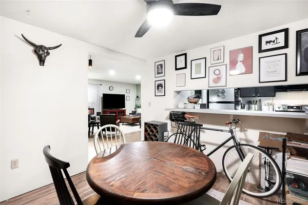 a dining room with furniture and window