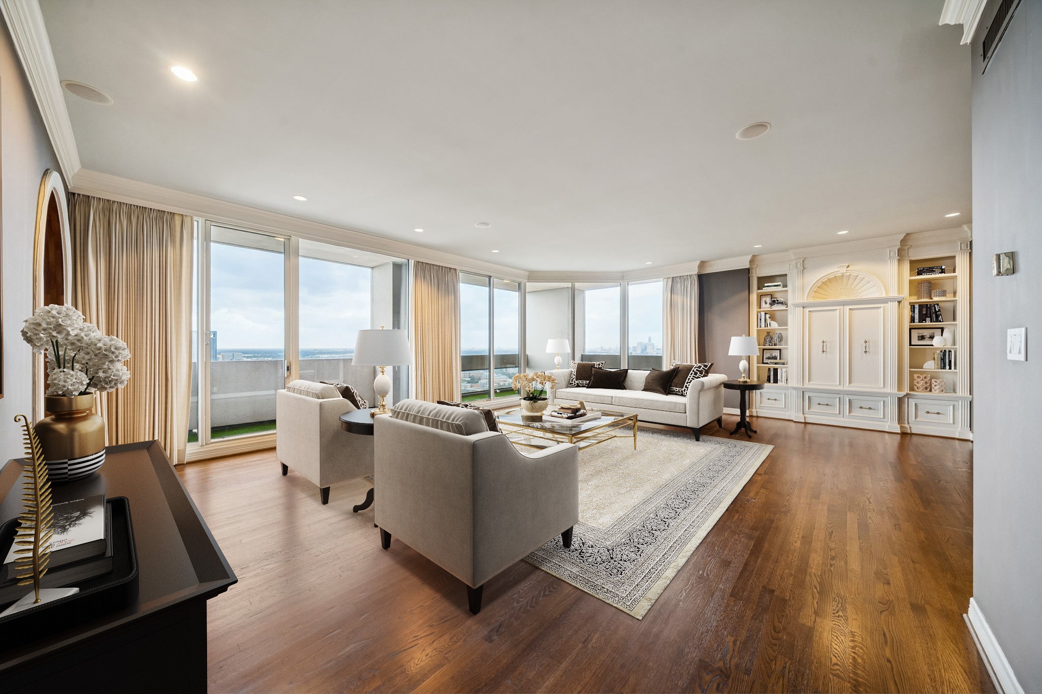1111 Hermann Drive, Unit 28D Houston, TX 77004 - Photo 13 of 49 a living room with furniture a large window wooden floor and a rug