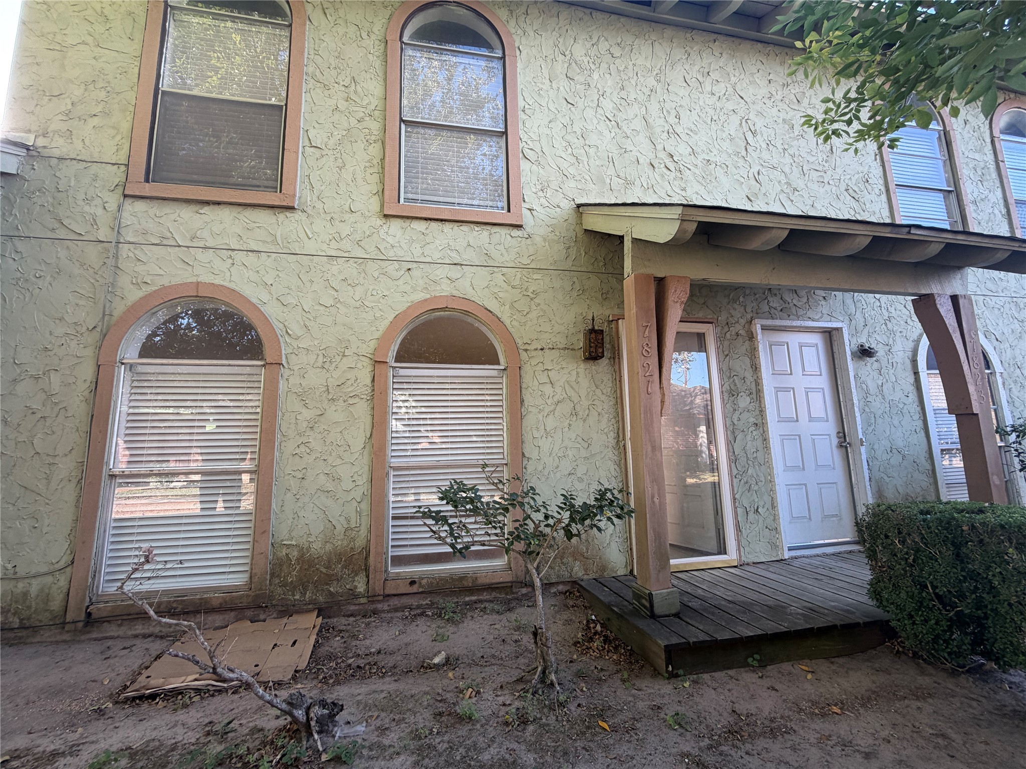 7821 Cook Road Houston, TX 77072 - Photo 1 of 15 a front view of a house with garden