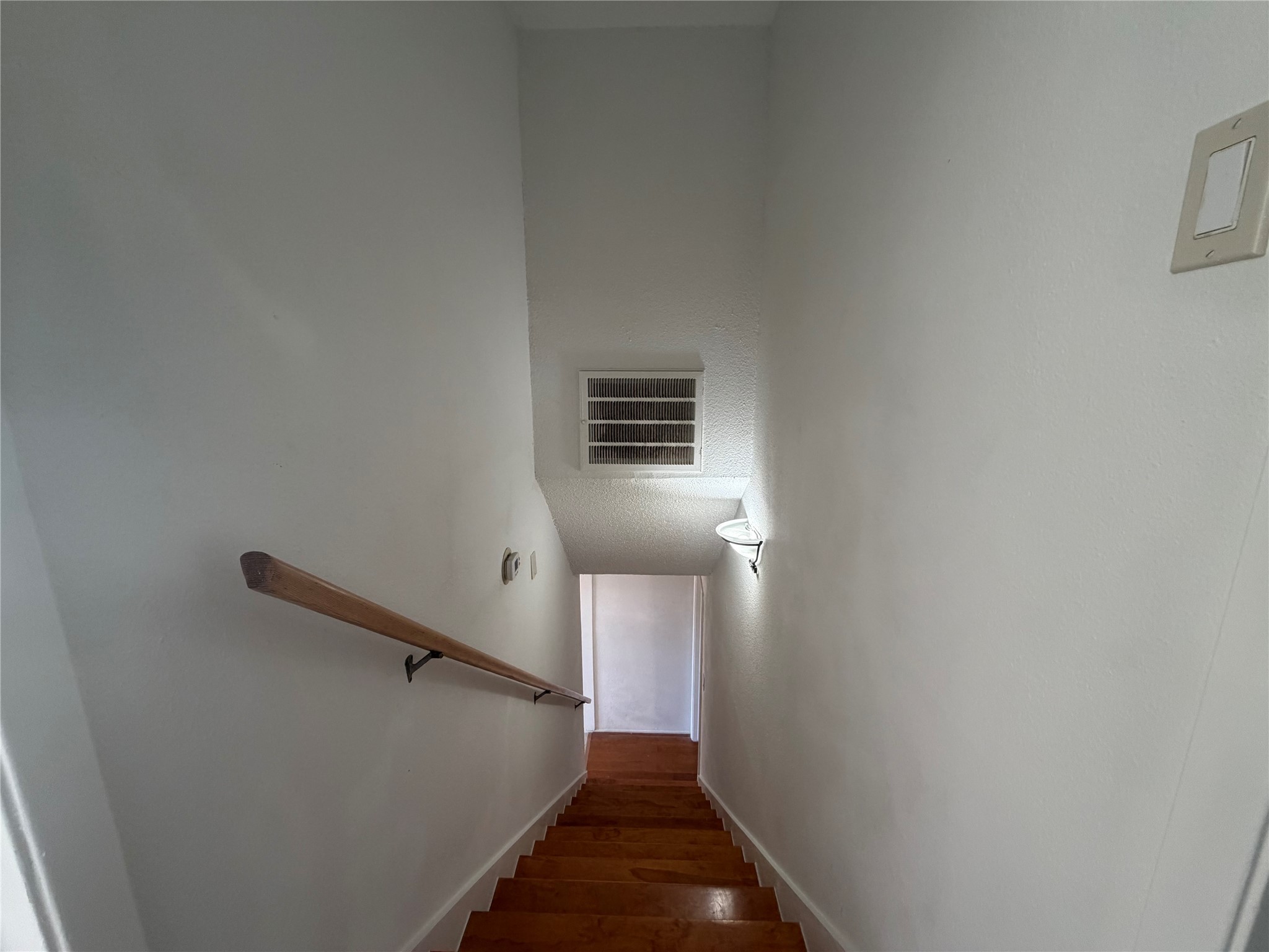 7821 Cook Road Houston, TX 77072 - Photo 14 of 15 a view of entryway and hall with wooden floor