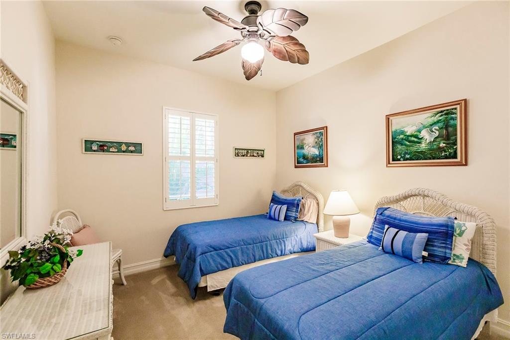 7684 Cottesmore Drive Naples, FL 34113 - Photo 39 of 46 a bedroom with two beds and a potted plant