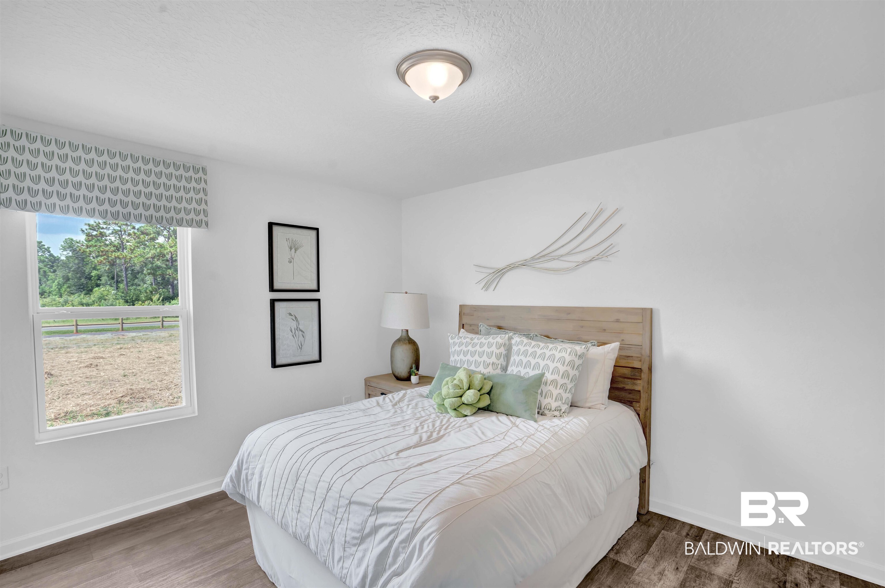 14717 Dayton Circle Foley, AL 36535 - Photo 9 of 39 Bedroom featuring hardwood / wood-style floors and a textured ceiling