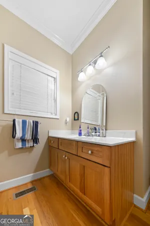 a bathroom with a sink and a mirror