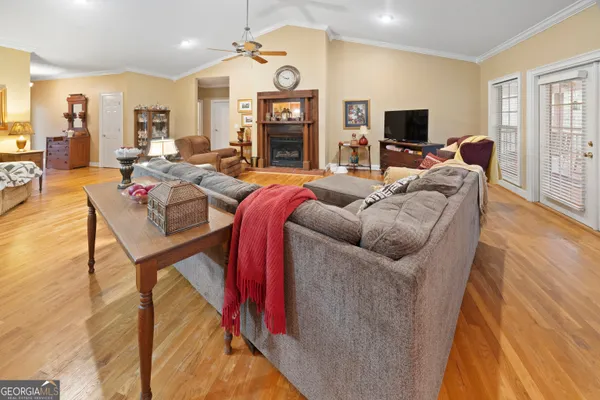 a living room with furniture and a flat screen tv