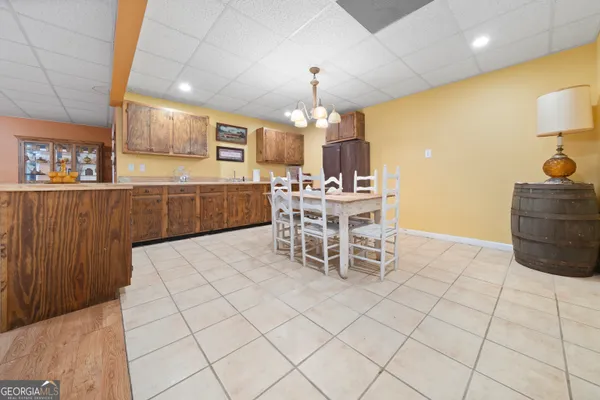 a kitchen with stainless steel appliances kitchen island granite countertop a sink and cabinets