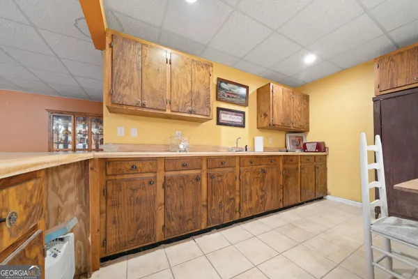 a kitchen with sink cabinets and window