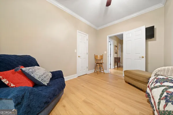 a bedroom with a bed and a couch