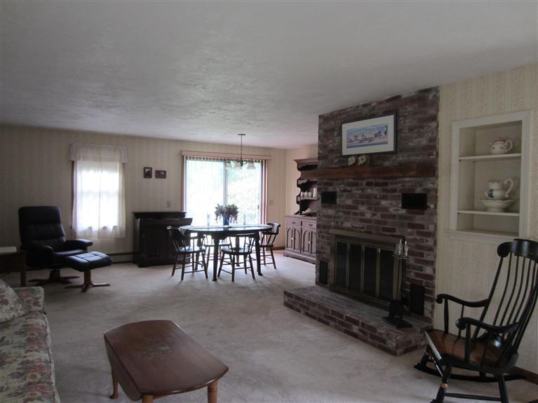 16 Forest Road Forestdale, MA 02644 - Photo 3 of 9 a living room with furniture and a fireplace
